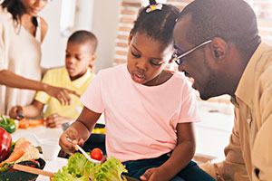 Parents teaching kids to eat healthy