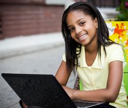 Young girl using a laptop