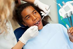 Girl getting her teeth cleaned