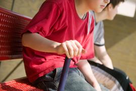 How do pay-to-play sports programs impact participation in school sports?