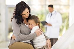 Parent with child at doctor's office