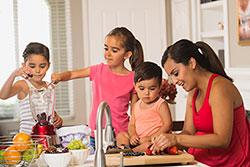 Mom preparing meal with her kids